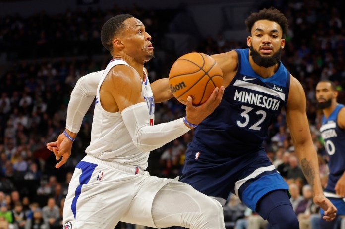 NBA: Los Angeles Clippers at Minnesota Timberwolves Los Angeles Clippers guard Russell Westbrook (0) drives to the basket past Minnesota Timberwolves forward Karl-Anthony Towns (32)