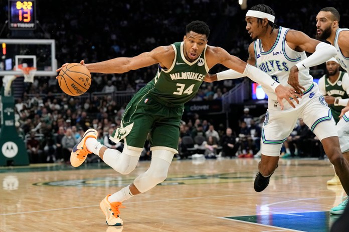 NBA: Minnesota Timberwolves at Milwaukee Bucks Milwaukee Bucks forward Giannis Antetokounmpo (34) drives for the basket against Minnesota Timberwolves forward Jaden McDaniels (3)
