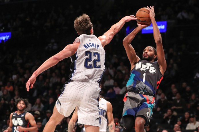 NBA: Orlando Magic at Brooklyn Nets Brooklyn Nets forward Mikal Bridges shoots over Orlando Magic forward Franz Wagner in the fourth quarter at Barclays Center.
