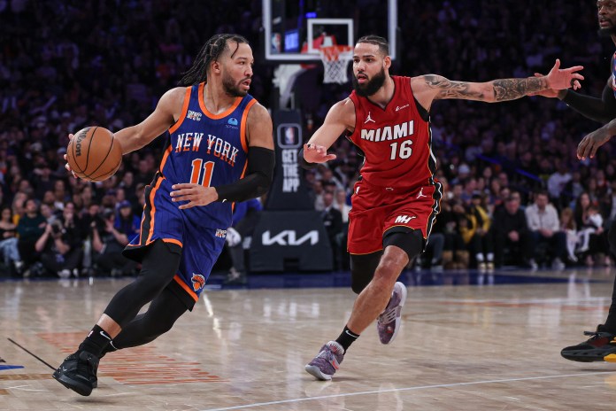NBA: Miami Heat at New York Knicks New York Knicks guard Jalen Brunson dribbles against Miami Heat forward Caleb Martin during the second half at Madison Square Garden.