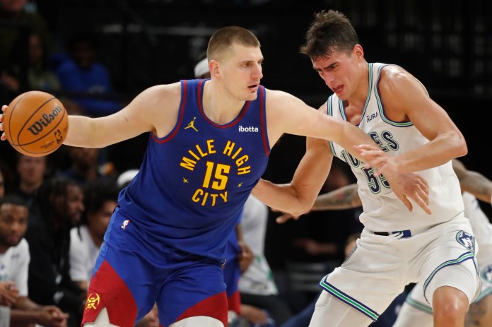 NBA: Denver Nuggets at Minnesota Timberwolves Denver Nuggets center Nikola Jokic works around Minnesota Timberwolves center Luka Garza in the fourth quarter at Target Center.