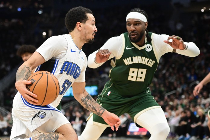 NBA: Orlando Magic at Milwaukee Bucks Orlando Magic guard Cole Anthony drives past Milwaukee Bucks forward Jae Crowder in the fourth quarter at Fiserv Forum.
