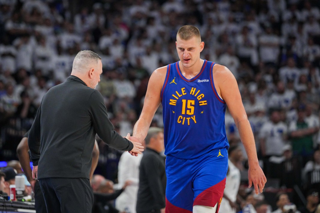 Denver Nuggets center Nikola Jokic (15) comes off the court against the Minnesota Timberwolves