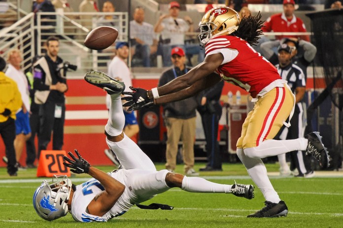 San Francisco 49ers wide receiver Brandon Aiyuk (11) reaches for a ball that bounced off the face mask of Detroit Lions cornerback Kindle Vildor (29)
