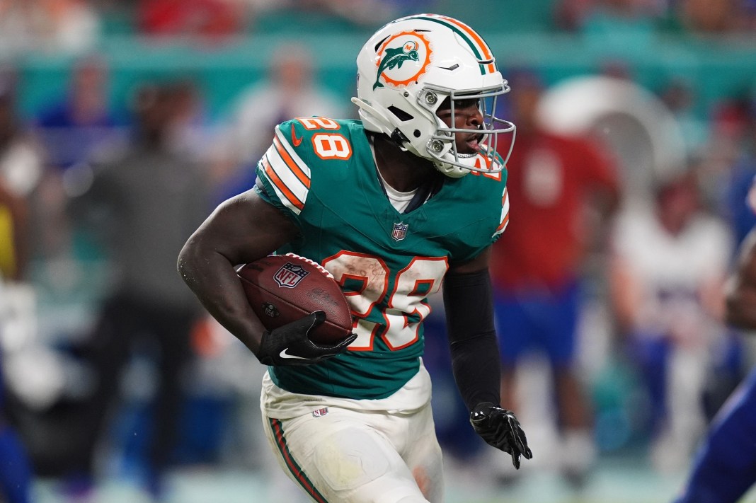 Miami Dolphins running back De'Von Achane (28) rushes with the ball during the second half against the Buffalo Bills at Hard Rock Stadium on September 12, 2024.