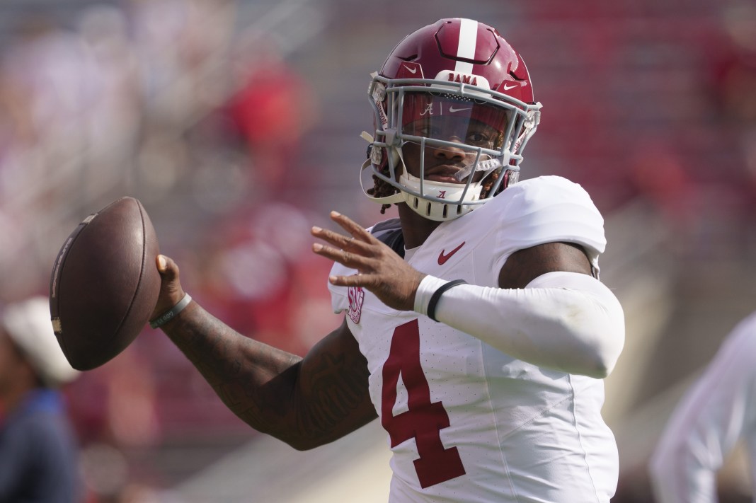 Alabama Crimson Tide quarterback Jalen Milroe (4) throws a pass during warmups prior to the game against the Wisconsin Badgers at Camp Randall Stadium on September 14, 2024.