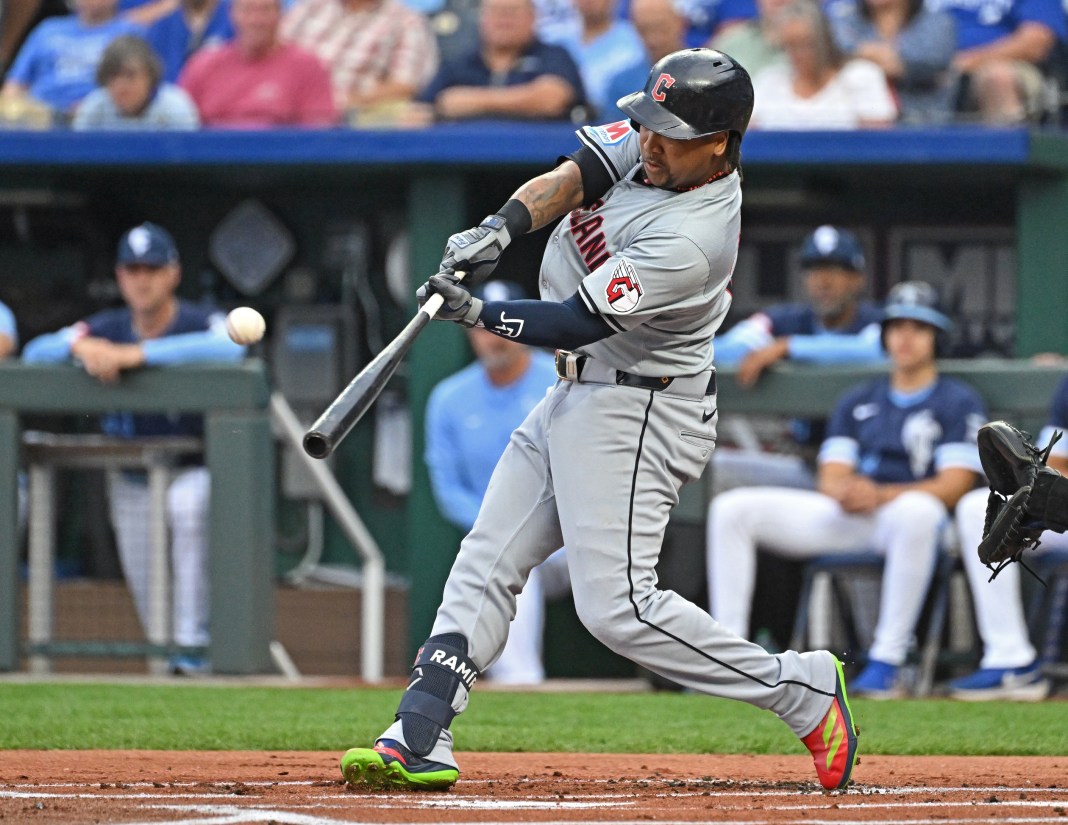 Cleveland Guardians third baseman Jose Ramirez (11) hits a solo home run in the first inning against the Kansas City Royals at Kauffman Stadium on June 28, 2024.