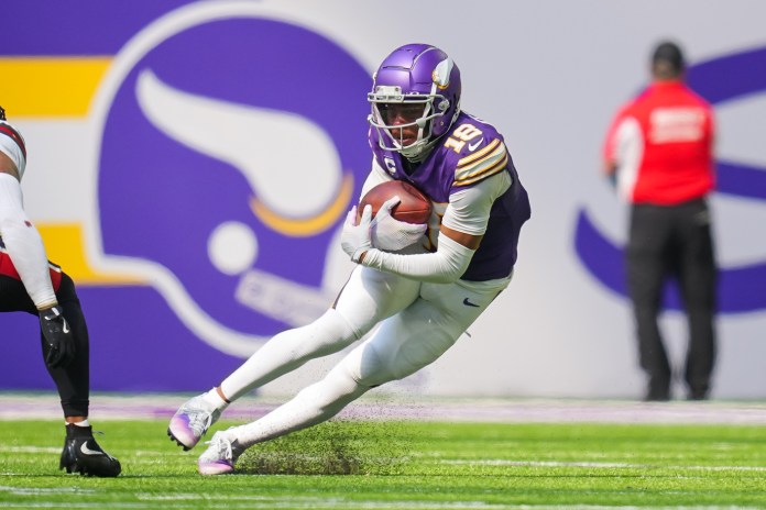 Minnesota Vikings wide receiver Justin Jefferson (18) runs after the catch during the second quarter against the Houston Texans at U.S. Bank Stadium on September 22, 2024.