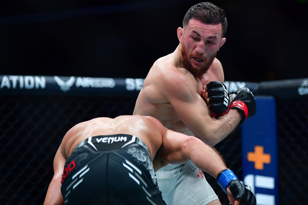 Merab Dvalishvili moves in with a hit against Henry Cejudo during UFC 298 at Honda Center in Anaheim, California, on February 17, 2024.