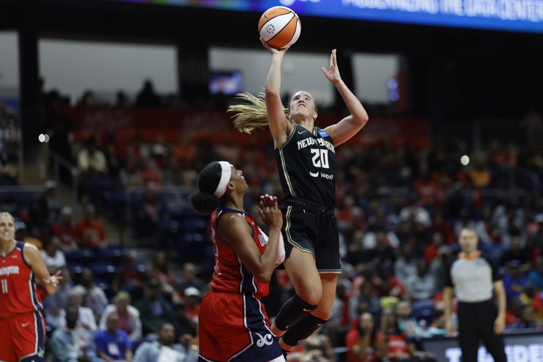 New York Liberty guard Sabrina Ionescu (20) shoots the ball as Washington Mystics guard Brittney Sykes (15) defends in the second quarter at Entertainment & Sports Arena on May 19, 2023.