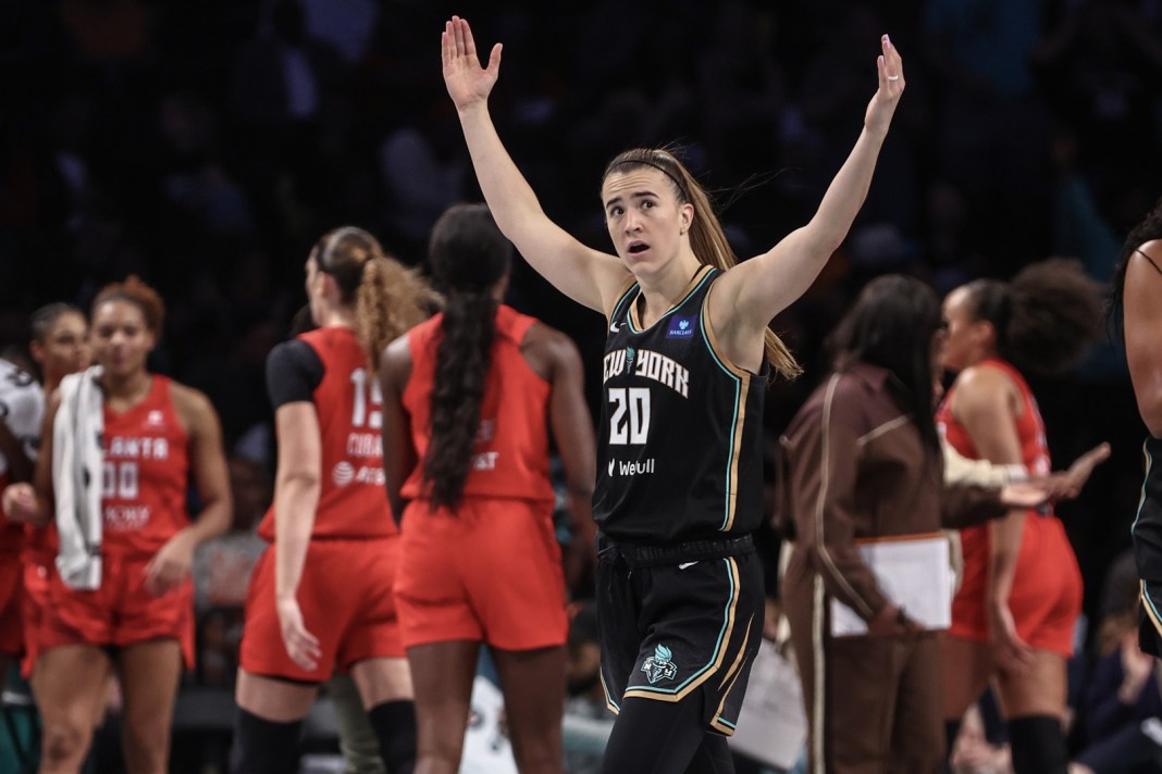 New York Liberty guard Sabrina Ionescu (20) celebrates during a timeout against the Atlanta Dream in Game 1 of the first round of the 2024 WNBA Playoffs at Barclays Center on September 22, 2024.