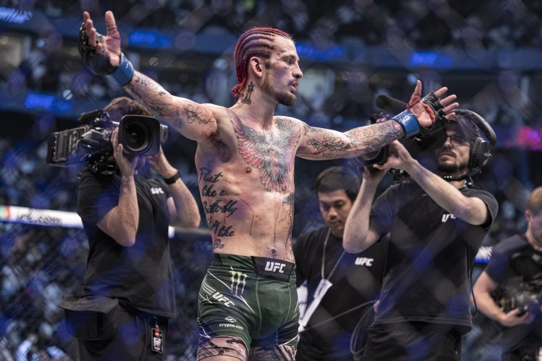 Sean O'Malley (blue gloves) defeats Petr Yan (red gloves) during UFC 280 at Etihad Arena in Abu Dhabi, UAE, on October 22, 2022.