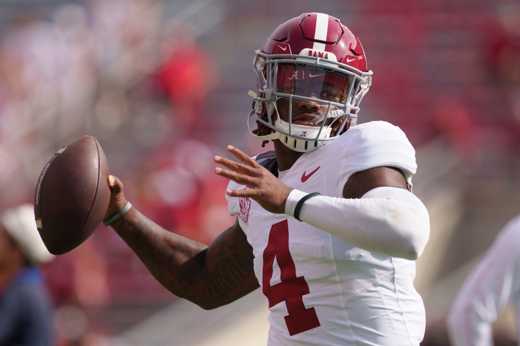 Alabama Crimson Tide quarterback Jalen Milroe (4) throws a pass during warmups before the game against the Wisconsin Badgers at Camp Randall Stadium on September 14, 2024.