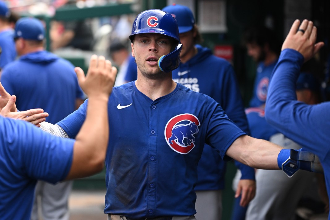 Chicago Cubs second baseman Nico Hoerner (2) celebrates scoring a run in the dugout during the fourth inning of the game against the Washington Nationals at Nationals Park on September 1, 2024.