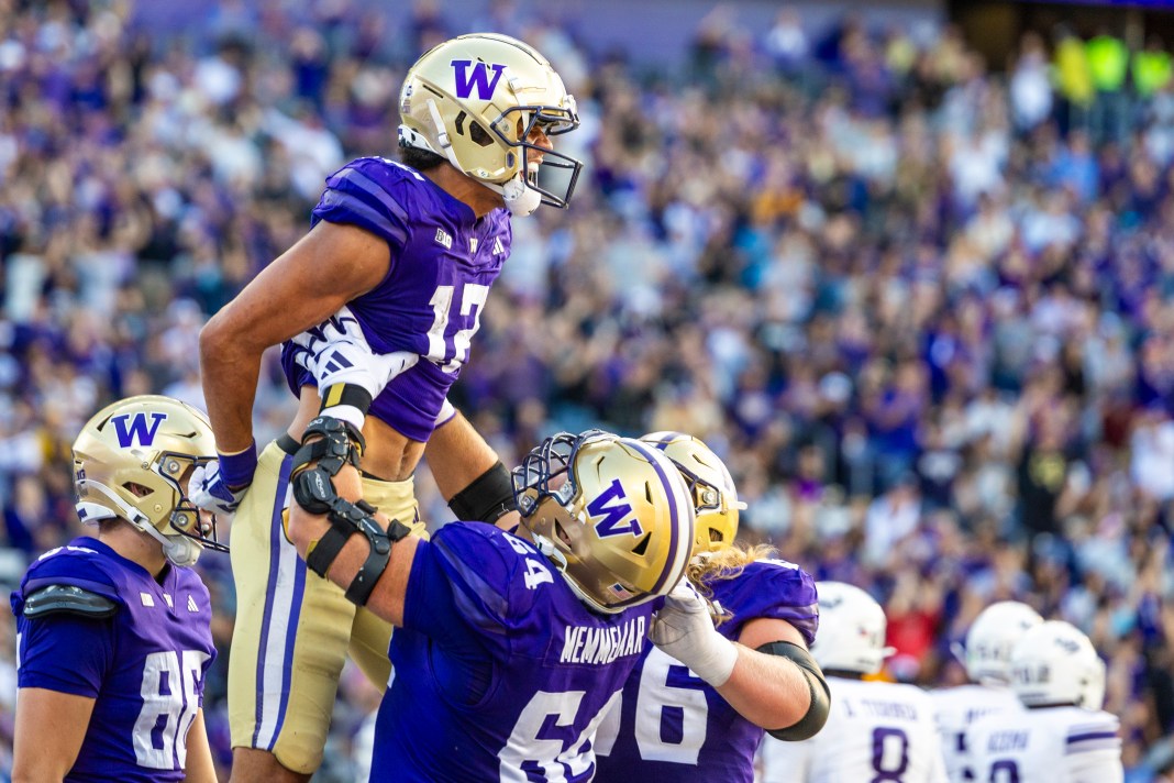 Washington Huskies wide receiver Denzel Boston (12) celebrates after catching a touchdown pass against the Northwestern Wildcats during the second quarter at Alaska Airlines Field at Husky Stadium on September 21, 2024.