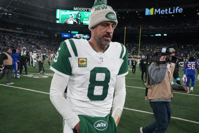 Aaron Rodgers of the Jets leaves the field at the end of the game. The Buffalo Bills came to MetLife Stadium to play the NY Jets
