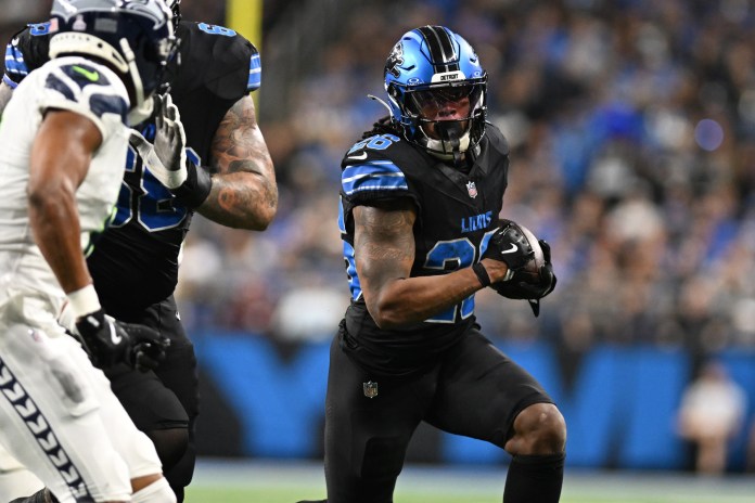 Detroit Lions running back Jahmyr Gibbs (26) runs the ball against the Seattle Seahawks in the fourth quarter at Ford Field