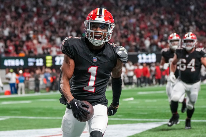 Atlanta Falcons wide receiver Darnell Mooney (1) reacts after scoring a touchdown against the Tampa Bay Buccaneers during the second half at Mercedes-Benz Stadium on October 3, 2024.