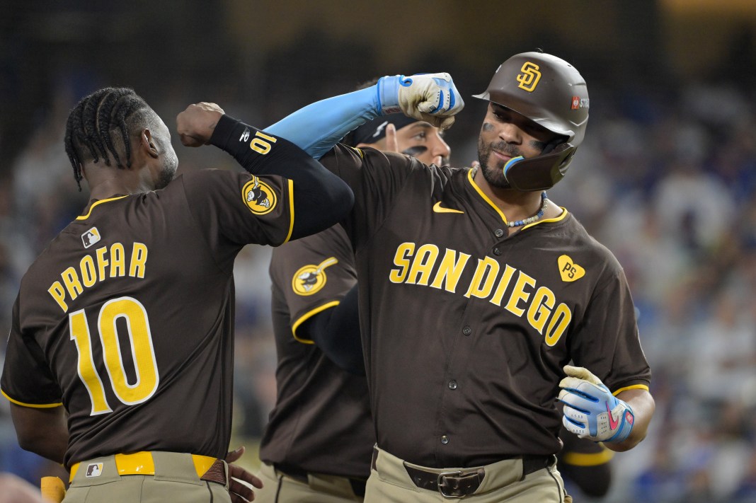San Diego Padres second baseman Xander Bogaerts (2) celebrates with outfielder Jurickson Profar (10) after hitting a solo home run in the eighth inning against the Los Angeles Dodgers during Game 2 of the NLDS for the 2024 MLB Playoffs at Dodger Stadium on October 6, 2024.