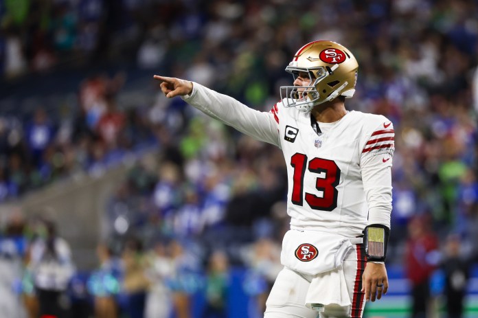 49ers quarterback Brock Purdy signals against the Seahawks in Week 6 of the 2024 NFL season.