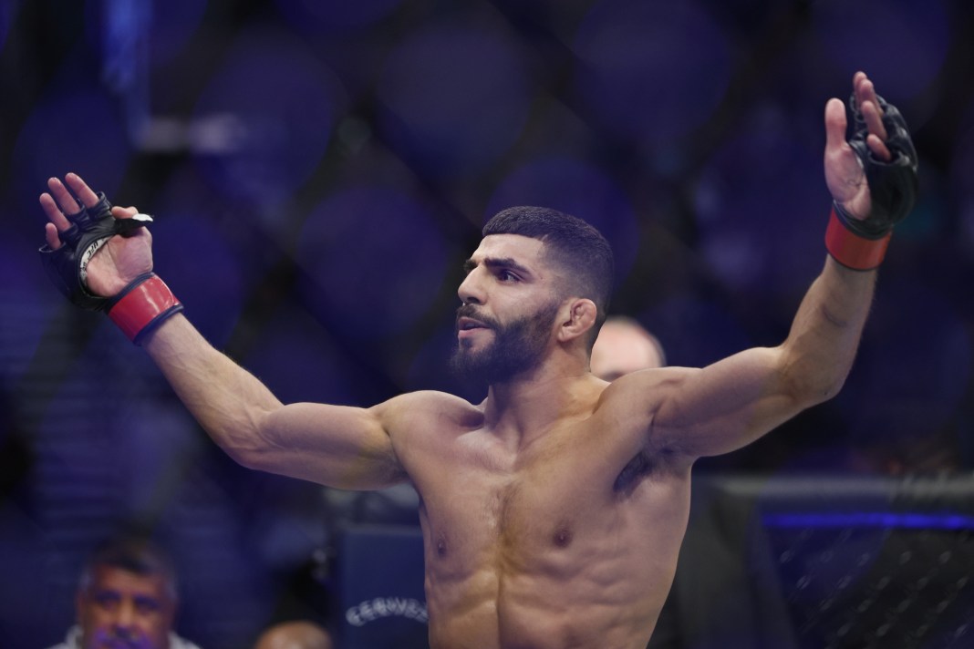 Amir Albazi (red gloves) reacts after defeating Francisco Figueiredo (blue gloves) during UFC 278 at Vivint Arena.