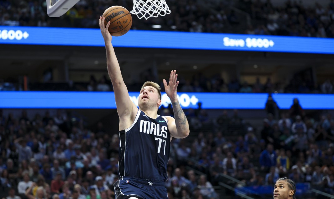 Dallas Mavericks guard Luka Doncic (77) shoots during the second half against the Houston Rockets at American Airlines Center.
