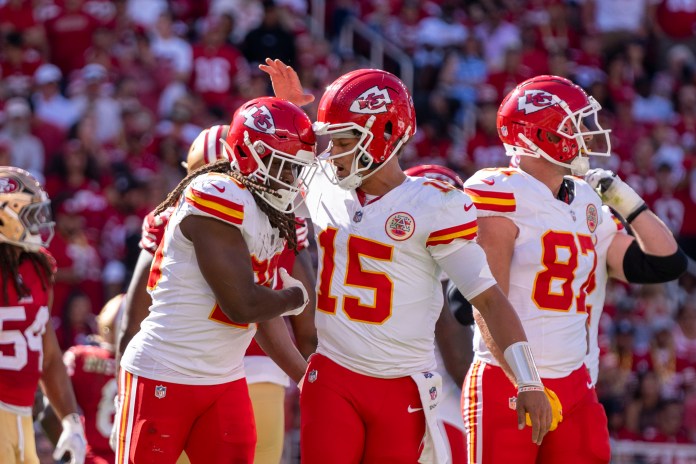 Kansas City Chiefs running back Kareem Hunt (29) is congratulated by quarterback Patrick Mahomes (15)