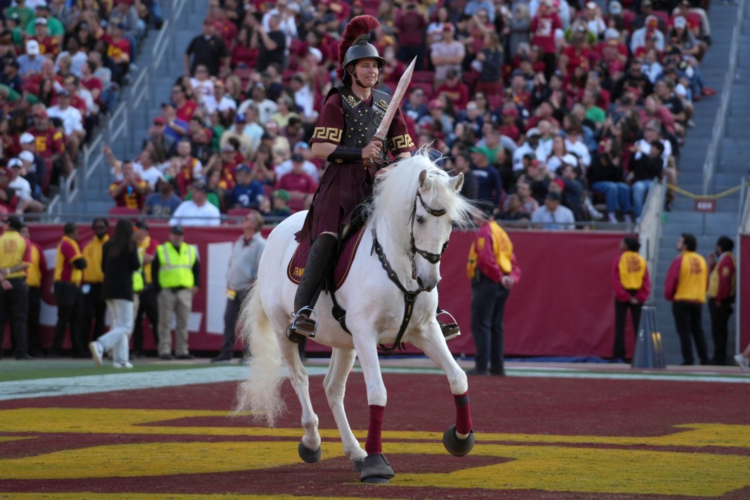USC Trojans mascot Traveler, ridden by Dana Kanstul, appears on the field during the game against Notre Dame at Los Angeles Memorial Coliseum on November 30, 2024.