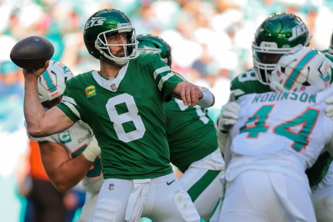 New York Jets quarterback Aaron Rodgers throws the football against the Miami Dolphins