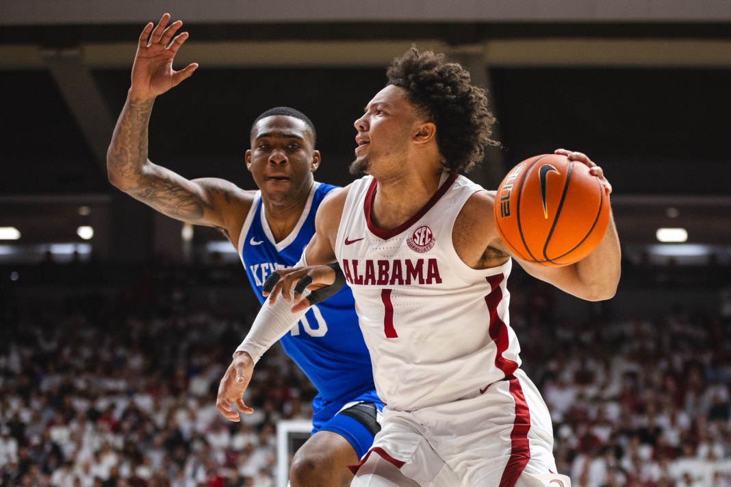 Alabama Crimson Tide guard Mark Sears (1) drives the ball against Kentucky Wildcats forward Brandon Garrison (10) during the first half at Coleman Coliseum on February 22, 2025.