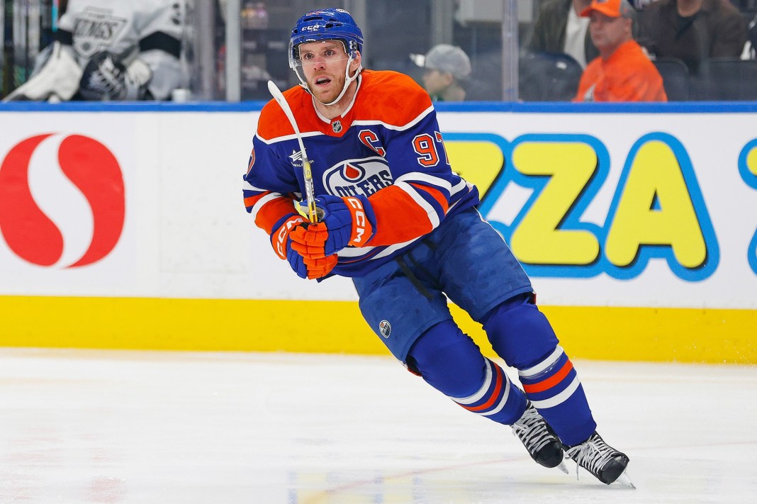 Oilers superstar Connor McDavid looks for a loose puck against the Kings during the 2024-25 NHL season.