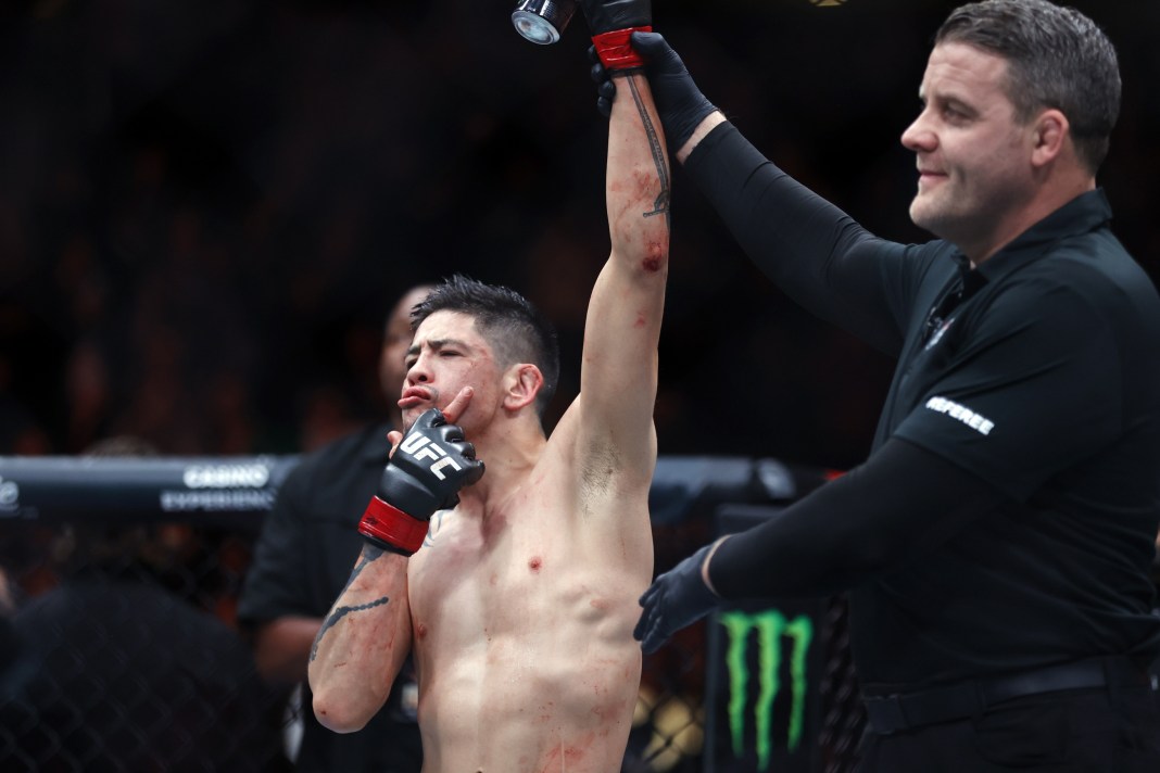 Brandon Moreno (red gloves) celebrates after defeating Amir Albazi in a flyweight bout at UFC Fight Night at Rogers Place in Edmonton, Alberta, Canada, on November 2, 2024.