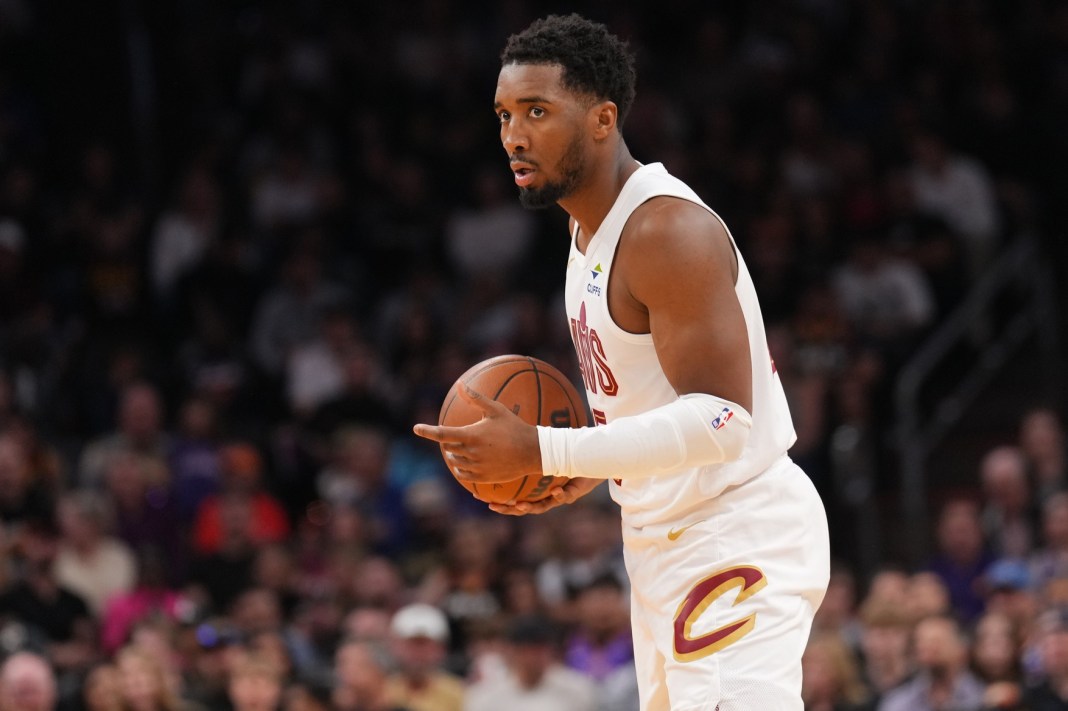 Cleveland Cavaliers guard Donovan Mitchell (45) controls the ball against the Phoenix Suns during the first half at Footprint Center in Phoenix, Arizona, on March 21, 2025.