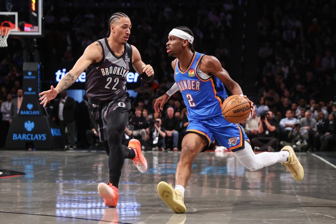 Oklahoma City Thunder guard Shai Gilgeous-Alexander (2) looks to drive past Brooklyn Nets forward Jalen Wilson (22) during the first quarter at Barclays Center on February 26, 2025.