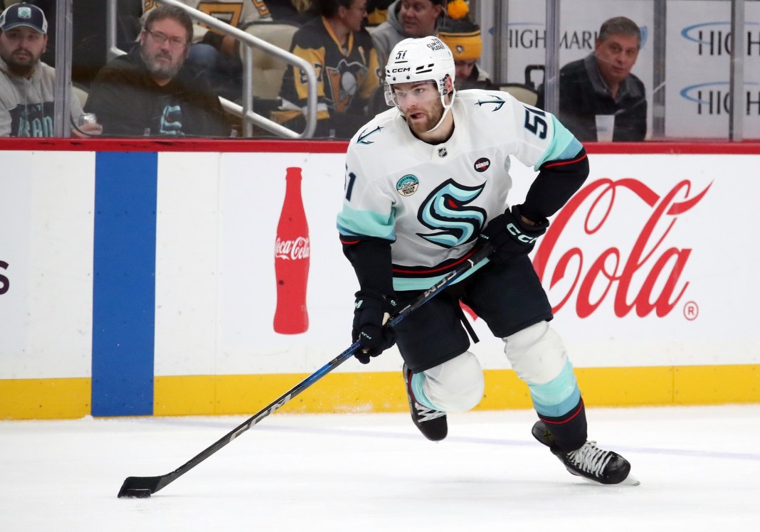 Seattle Kraken center Shane Wright (51) skates with the puck against the Pittsburgh Penguins during the second period at PPG Paints Arena on January 14, 2025.