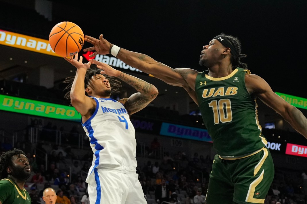 Memphis Tigers guard PJ Haggerty (4) has his shot blocked by UAB Blazers guard Alejandro Vasquez (10) during the second half at Dickies Arena in Fort Worth, TX, on March 16, 2025.