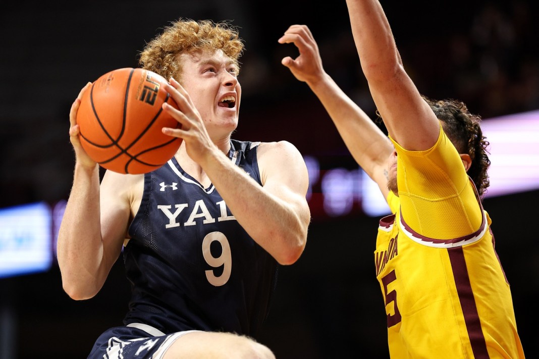 Yale Bulldogs forward Riley Fox (9) drives towards the basket as Minnesota Golden Gophers guard Lu'Cye Patterson (25) defends during the second half at Williams Arena on November 16, 2024.