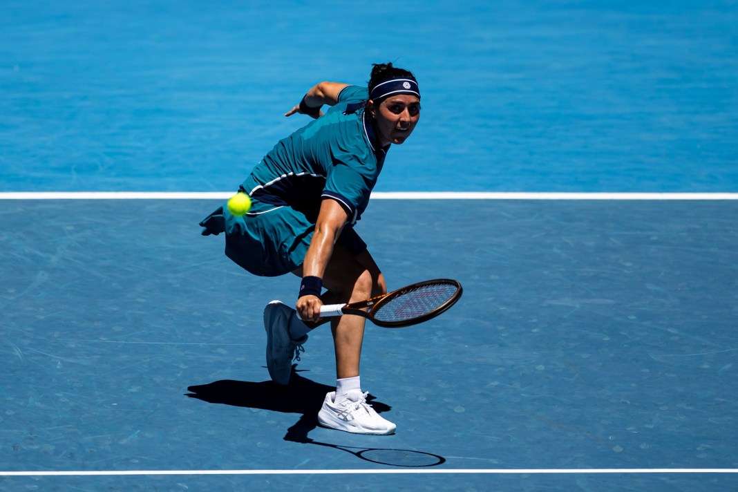 Ons Jabeur hits a backhand slice against Emma Navarro at the 2025 Australian Open.