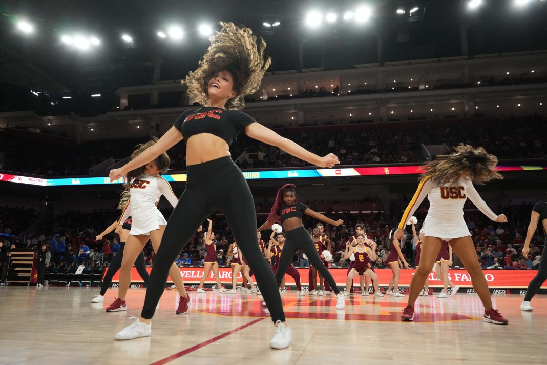 Southern California Trojans song girls and dance force team cheerleaders perform during the game against the UCLA Bruins at the Galen Center on January 27, 2025.
