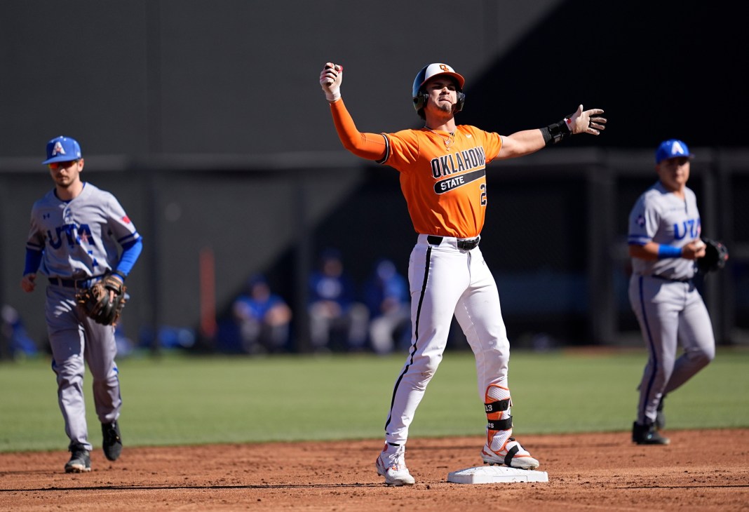 Oklahoma State's Jayson Jones (23) celebrates a double in the first inning during the college baseball game between the Oklahoma State University Cowboys and the UT Arlington at O'Brate Stadium in Stillwater, Oklahoma, on February 23, 2025.