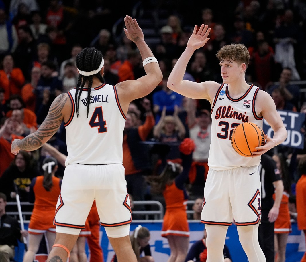 Illinois guards Kylan Boswell (4) and Kasparas Jakucionis (32) celebrate their victory over Xavier at the end of their first-round NCAA men’s basketball tournament game at Fiserv Forum in Milwaukee, WI, on March 21, 2025.