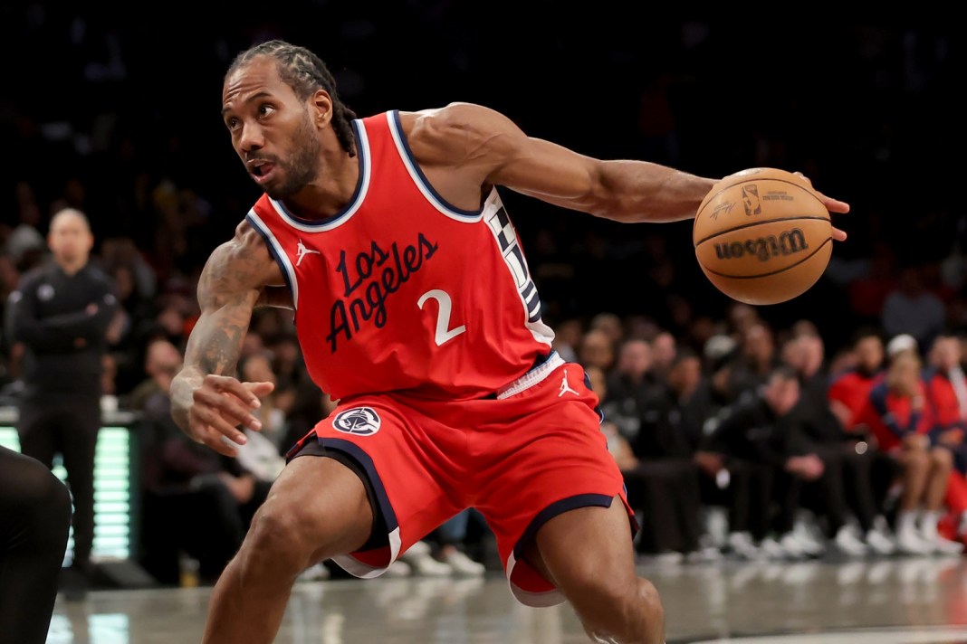 Clippers star Kawhi Leonard drives against the Nets during the 2024-25 NBA season.