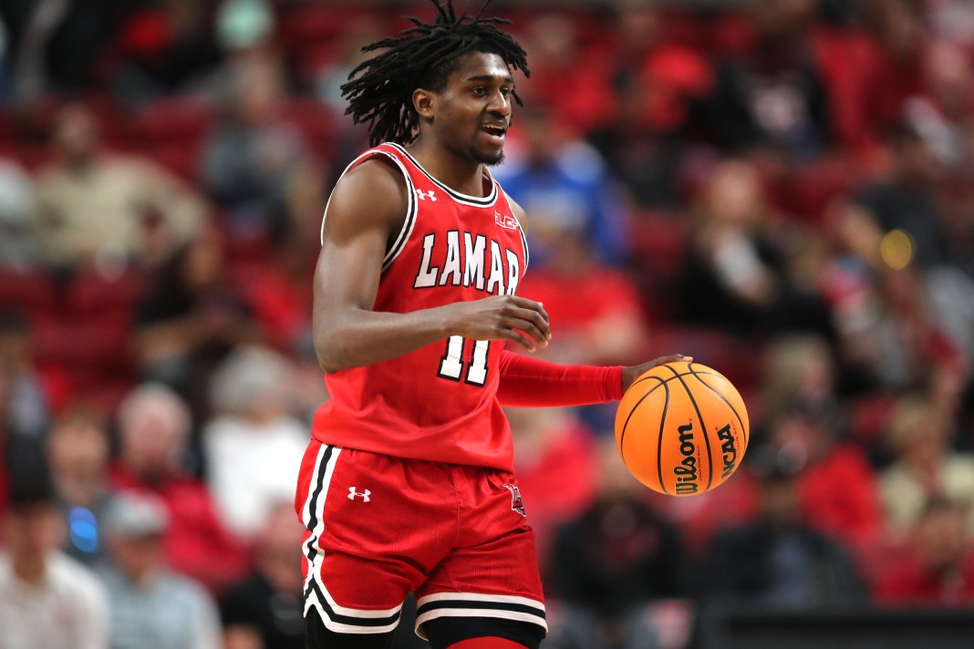 Lamar Cardinals guard Ja’Sean Jackson (11) brings the ball up court against the Texas Tech Red Raiders during the second half at United Supermarkets Arena on December 21, 2024.