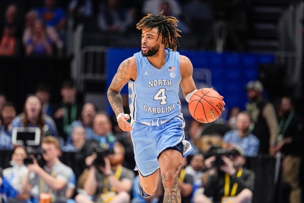 North Carolina Tar Heels guard RJ Davis (4) brings the ball up court against Duke Blue Devils during the first half at Spectrum Center on March 14, 2025.