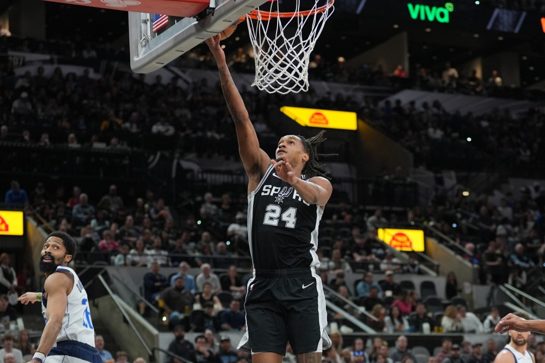 Spurs wing Devin Vassell makes a layup against the Mavericks during the 2024-25 NBA season.