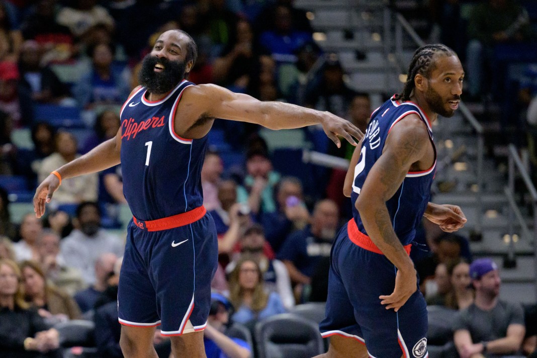 Clippers stars James Harden and Kawhi Leonard react to a play against the Pelicans during the 2024-25 NBA season.