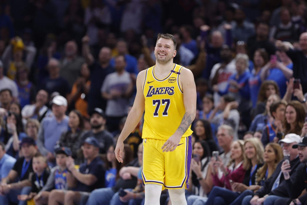 Lakers star Luka Doncic laughs during a game against the Thunder during the 2024-25 NBA season.