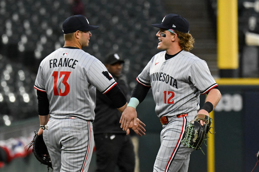 Minnesota Twins first baseman Ty France (13) and outfielder Harrison Bader (12) after a game against the Chicago White Sox at Guaranteed Rate Field in Chicago, Illinois, on April 2, 2025.